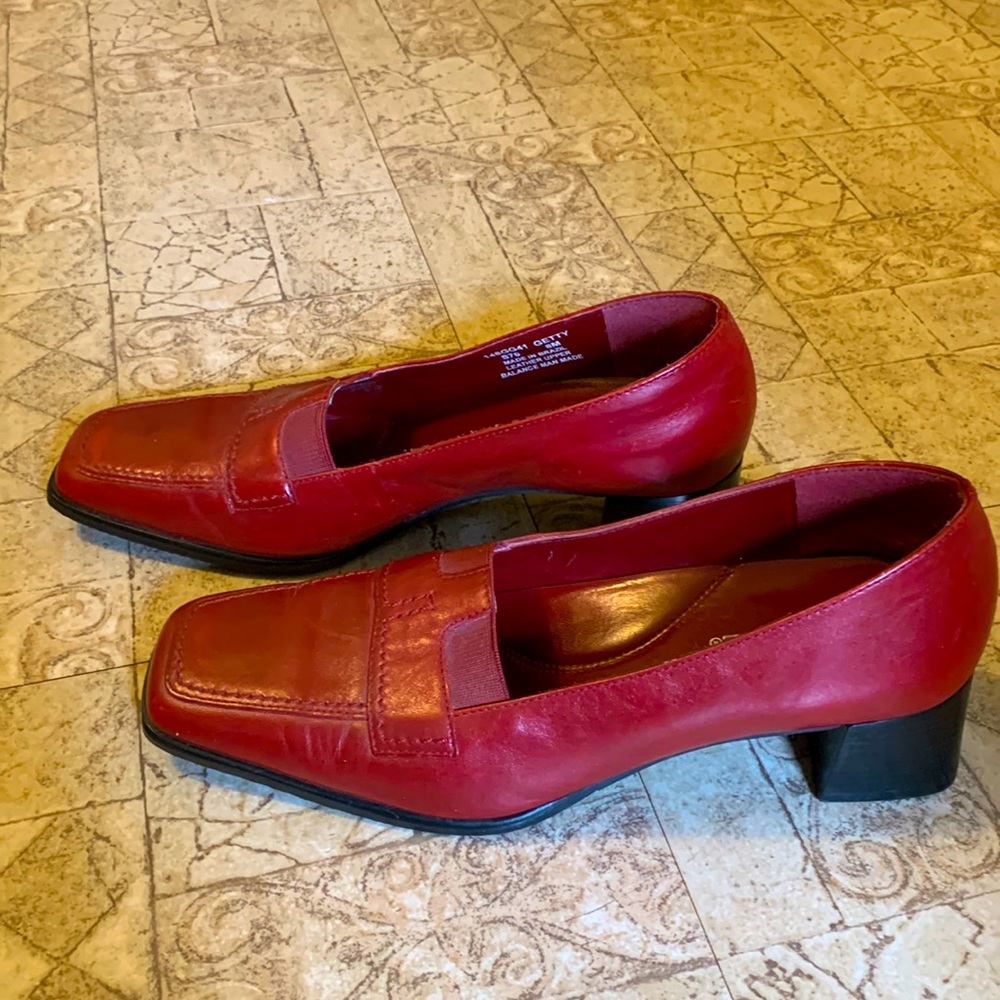 Vintage red leather loafers with block heels.